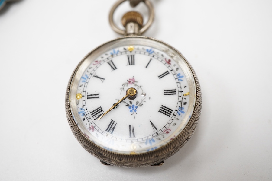 An enamel chatelaine, late 19th/early 20th century, composed of metal plaques applied with foliate patterns in blue, black and red enamel, indistinctly stamped maker's marks, suspending a silver pin cushion and a silver